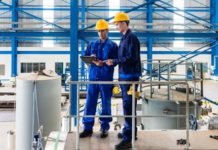 Three Ways to Evaluate the Success of Your ERP Implementation Plan manufacturing, plant, hard hats, workers