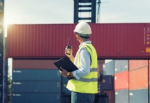 Inviting Finance to the S&OP Party man, containers, hard hat