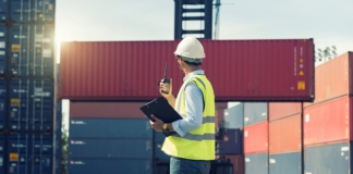 man, containers, hard hat